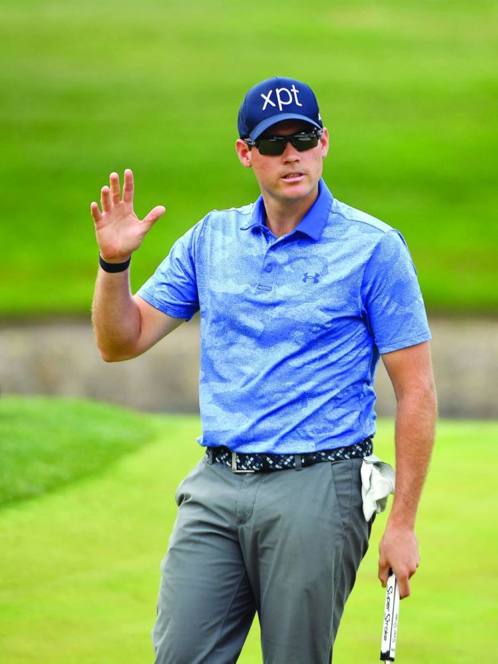 
Adam Schenk of the US waves to the crowd after making a putt for birdie on the 18th hole during the third round of the Charles Schwab Challenge at Colonial Country Club in Fort Worth, Texas. (AFP) 