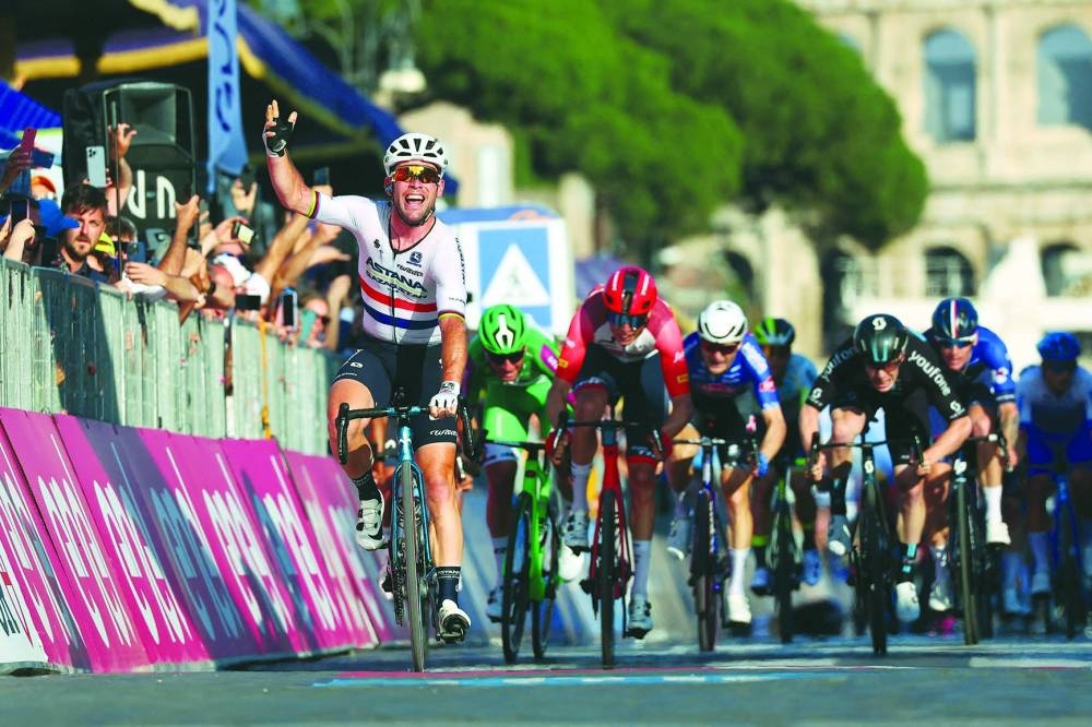 Astana Qazaqstan Team’s British rider Mark Cavendish celebrates as he crosses the finish line to win the twenty-first and last stage of the Giro d’Italia 2023 cycling race after covering a distance of 135kms in and around Rome on Sunday. (AFP)