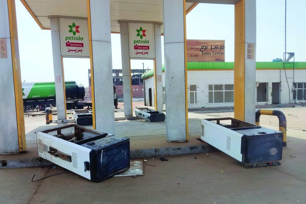 Picture shows the damage at a looted petrol station in southern Khartoum, on Sunday, as fighting between two rival generals persists.