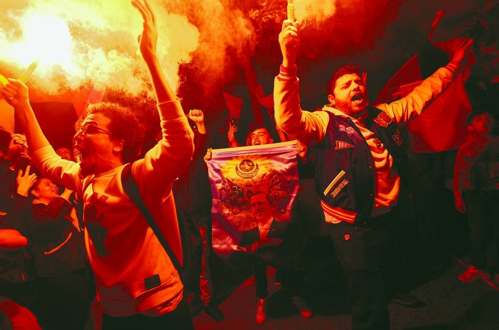 Supporters react following early exit poll results. (Reuters)