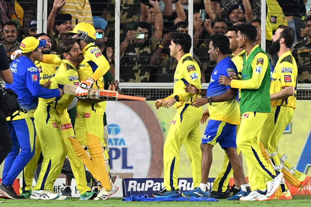 Chennai Super Kings' players celebrate their win at the end of the Indian Premier League (IPL) Twenty20 final cricket match between Gujarat Titans and Chennai Super Kings at the Narendra Modi Stadium in Ahmedabad on Monday. (AFP)