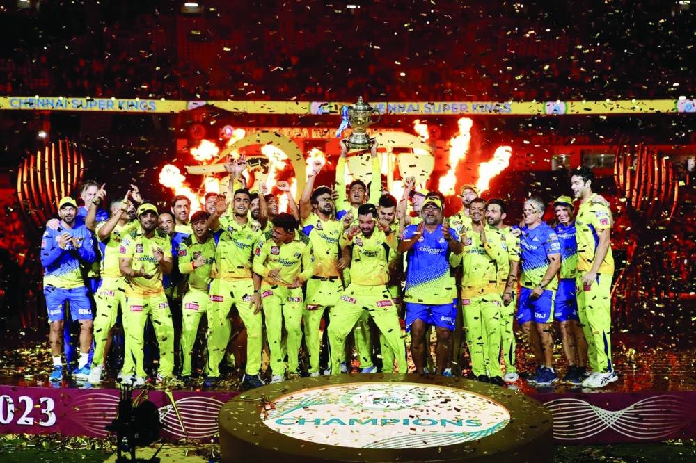 
Chennai Super Kings skipper MS Dhoni and teammates celebrate with trophy after winning IPL in Ahmedabad.  