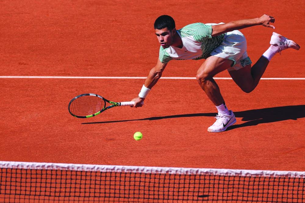 Spain’s Carlos Alcaraz in action against Japan’s Taro Daniel during their match on day four of the French Open in Paris on Wednesday. (AFP)