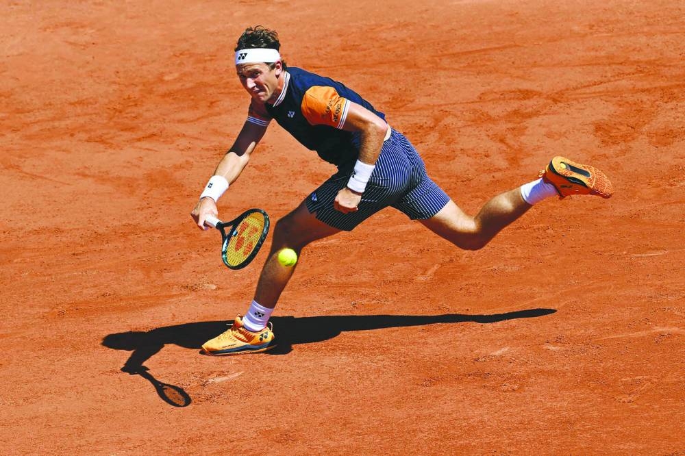 Norway’s Casper Ruud plays a forehand return to Italy’s Giulio Zeppieri in Paris on Thursday. (AFP)