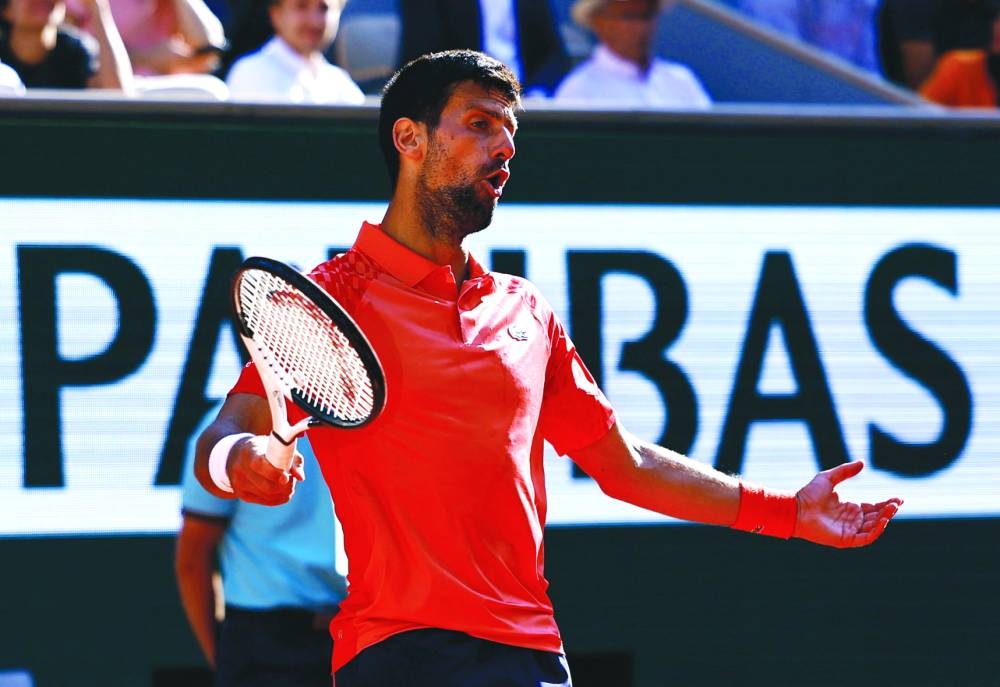 Serbia’s Novak Djokovic reacts during his third round match against Spain’s Alejandro Davidovich Fokina at the French Open in Paris on Friday. Djokovic won 7-6 (7/4), 7-6 (7/5), 6-2. (Reuters)