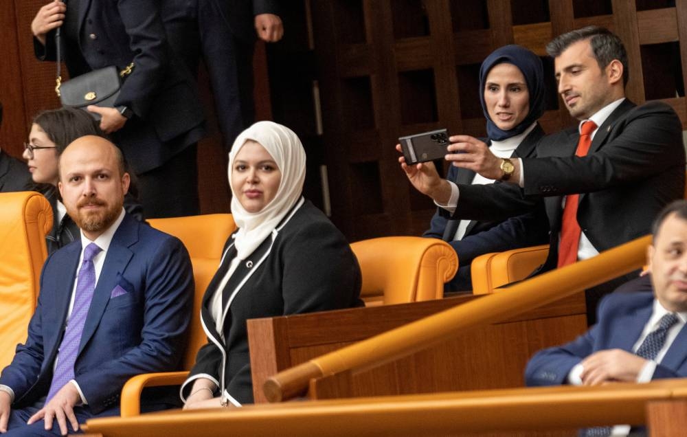 Bilal Erdogan, son of Turkish President Tayyip Erdogan, Bilal Erdogan's wife Reyyan Uzuner, Selcuk Bayraktar, chairman of Turkish defence firm Baykar and son in law of Erdogan and Erdogan's daughter and Bayraktar's wife Sumeyye Erdogan attend his swearing-in ceremony of President Tayyip Erdogan after his election win at the Turkish Parliament in Ankara. REUTERS/Umit Bektas