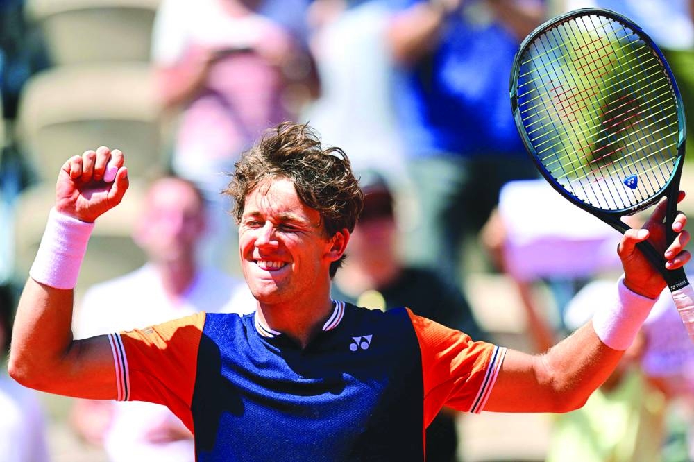 Norway’s Casper Ruud celebrates after his win over China’s Zhang Zhizhen at the French Open on Saturday. (AFP)