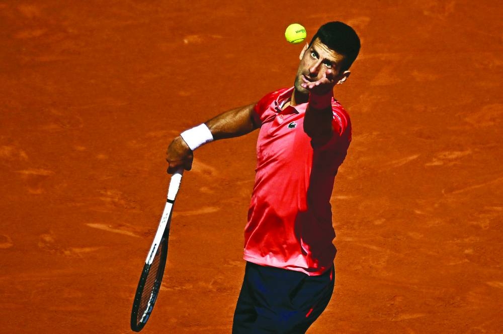 Serbia’s Novak Djokovic serves to Peru’s Juan Pablo Varillas during their French Open match in Paris on Sunday. (AFP)