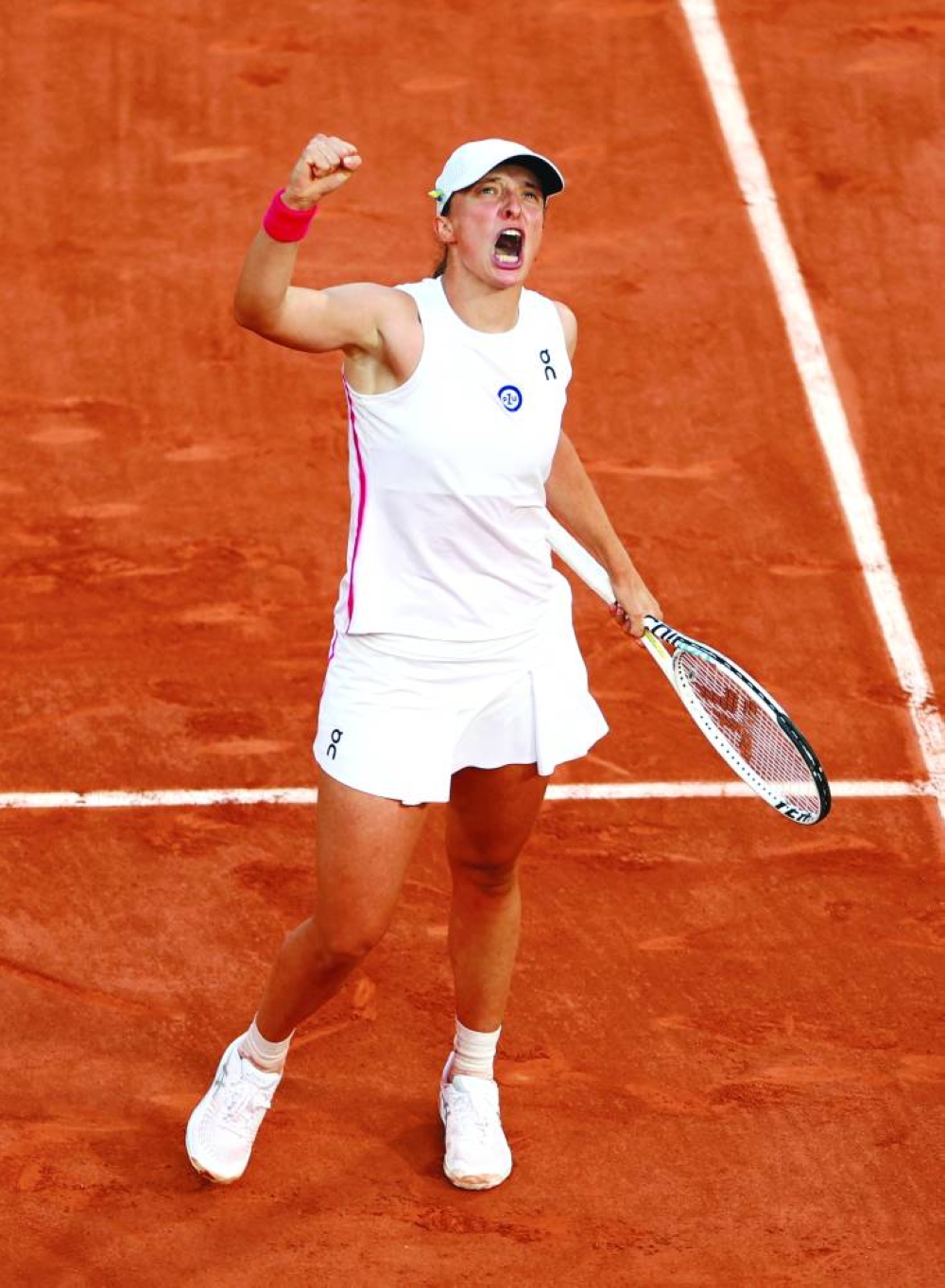 Poland’s Iga Swiatek celebrates winning her French Open semi-final against Brazil’s Beatriz Haddad Maia in Paris on Thursday. (Reuters)