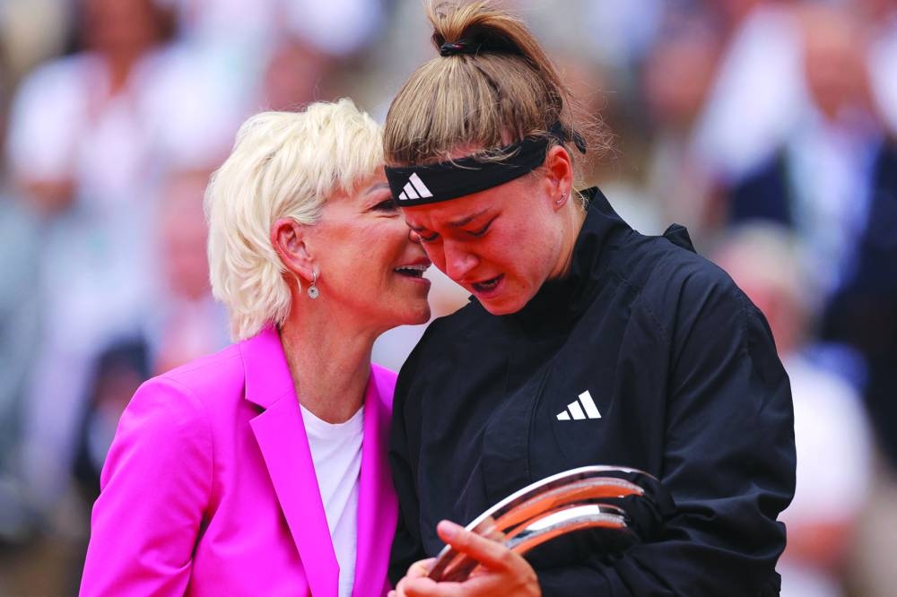 
Czech Republic’s Karolina Muchova (right) is comforted by former US tennis star Chris Evert after her loss to Iga Swiatek in the French Open final. (AFP) 