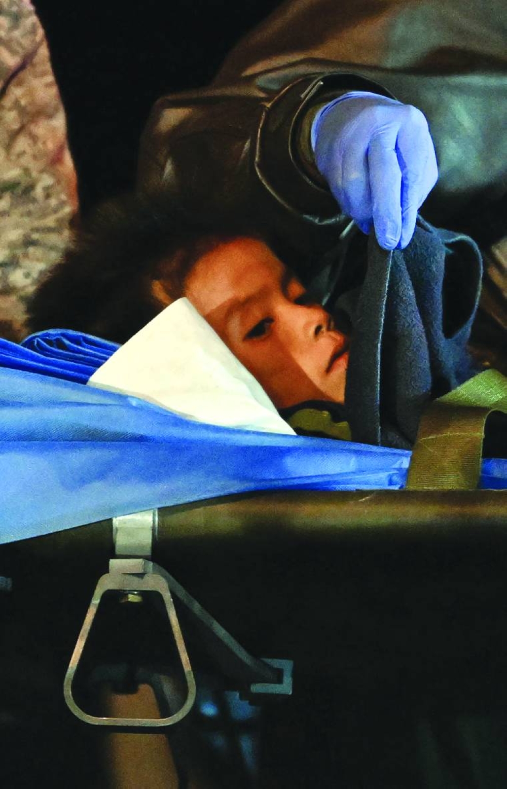 One of the four children stretchered out of a plane upon landing at the CATAM military base in Bogota yesterday. (AFP)