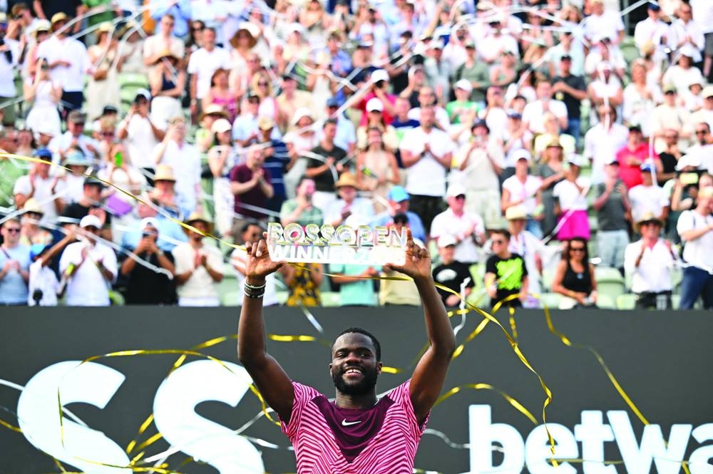 
Frances Tiafoe of the US celebrates with a trophy after winning the Stuttgart Open final against Germany’s Jan-Lennard Struff. (Reuters) 