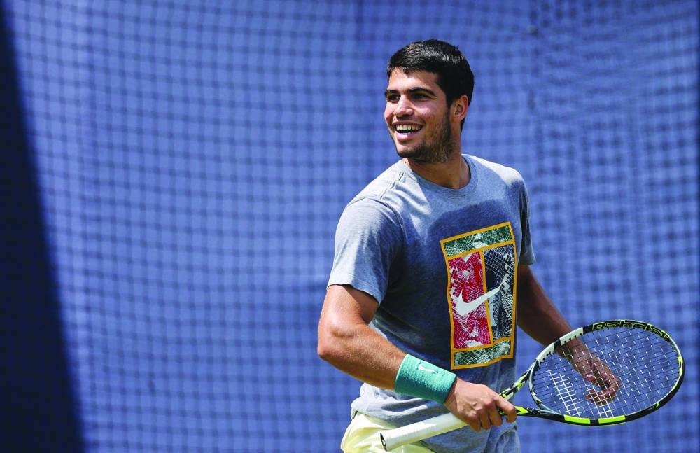 Spain's Carlos Alcaraz reacts during a training session on Day 3 of the Cinch ATP Championships at Queen's Club in west London. (AFP)