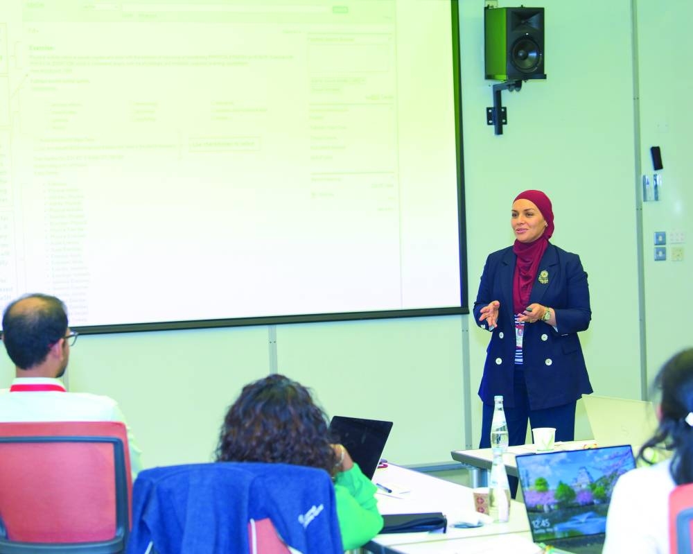  Dr Chaabna giving a presentation.