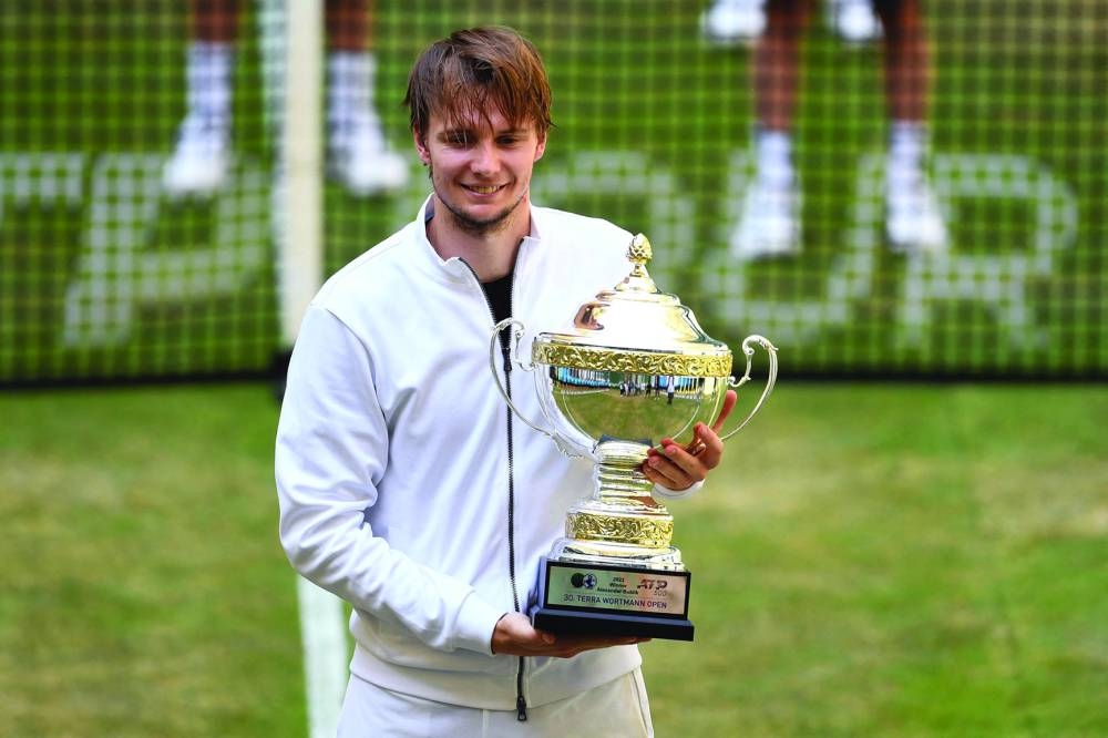 Kazakhstan's Alexander Bublik poses with his trophy after winning the singles final of the ATP 500 Halle Open, western Germany, on Sunday. (AFP)