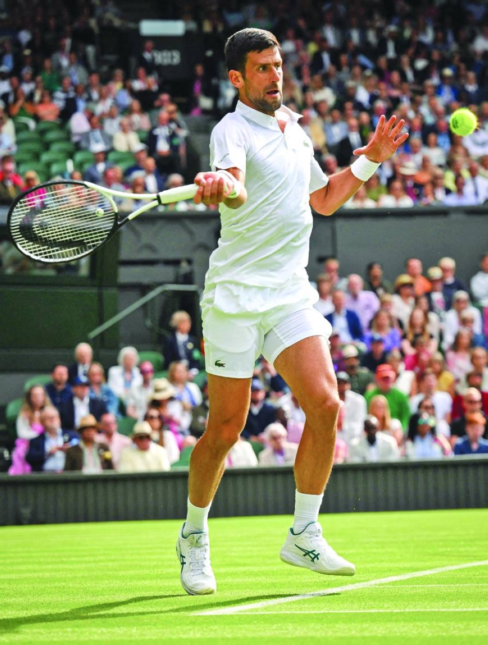 Serbia’s Novak Djokovic returns the ball to Argentina’s Pedro Cachin during their match on the first day of the 2023 Wimbledon 
Championships at The All England Tennis Club in Wimbledon, southwest London, on Monday. (AFP)