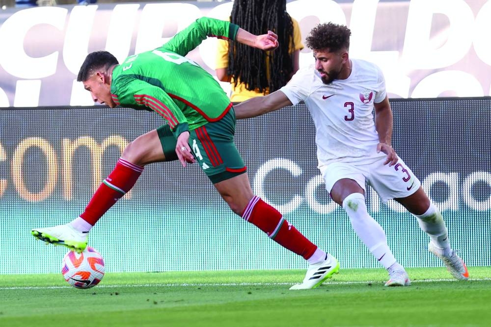 Qatar’s Hazem Shehata (right) vying for the ball with a Mexico player during their Concacaf Gold Cup group match in Santa Clara, California.  
PICTURES: Anas Khalid