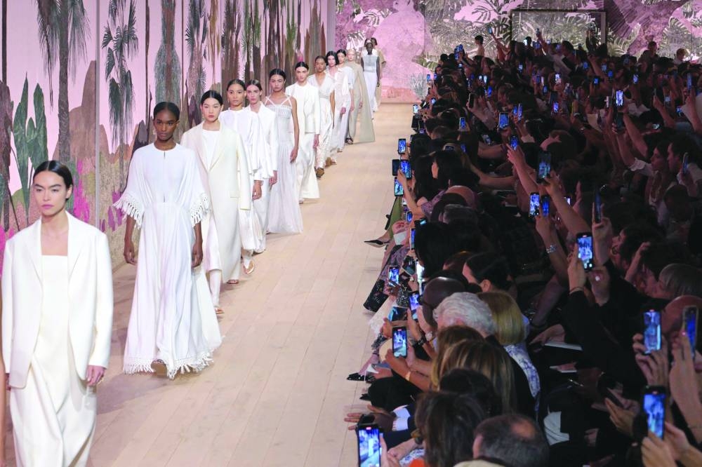 Models present creations by Christian Dior during the Women's Haute-Couture Fall/Winter 2023/2024 Fashion Week in Paris on Monday. AFP)