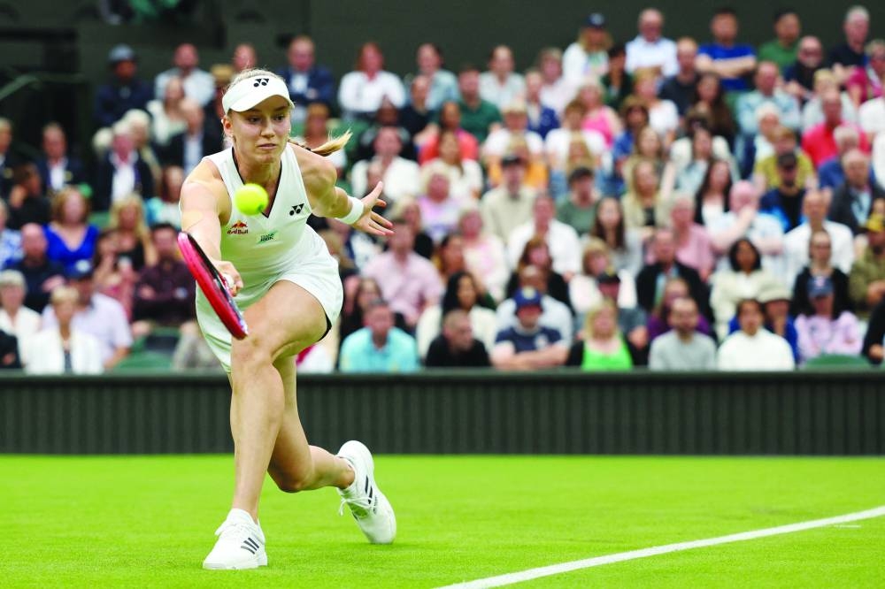 Kazakhstan’s Elena Rybakina returns the ball to US player Shelby Rogers during their first round match yesterday. (AFP)