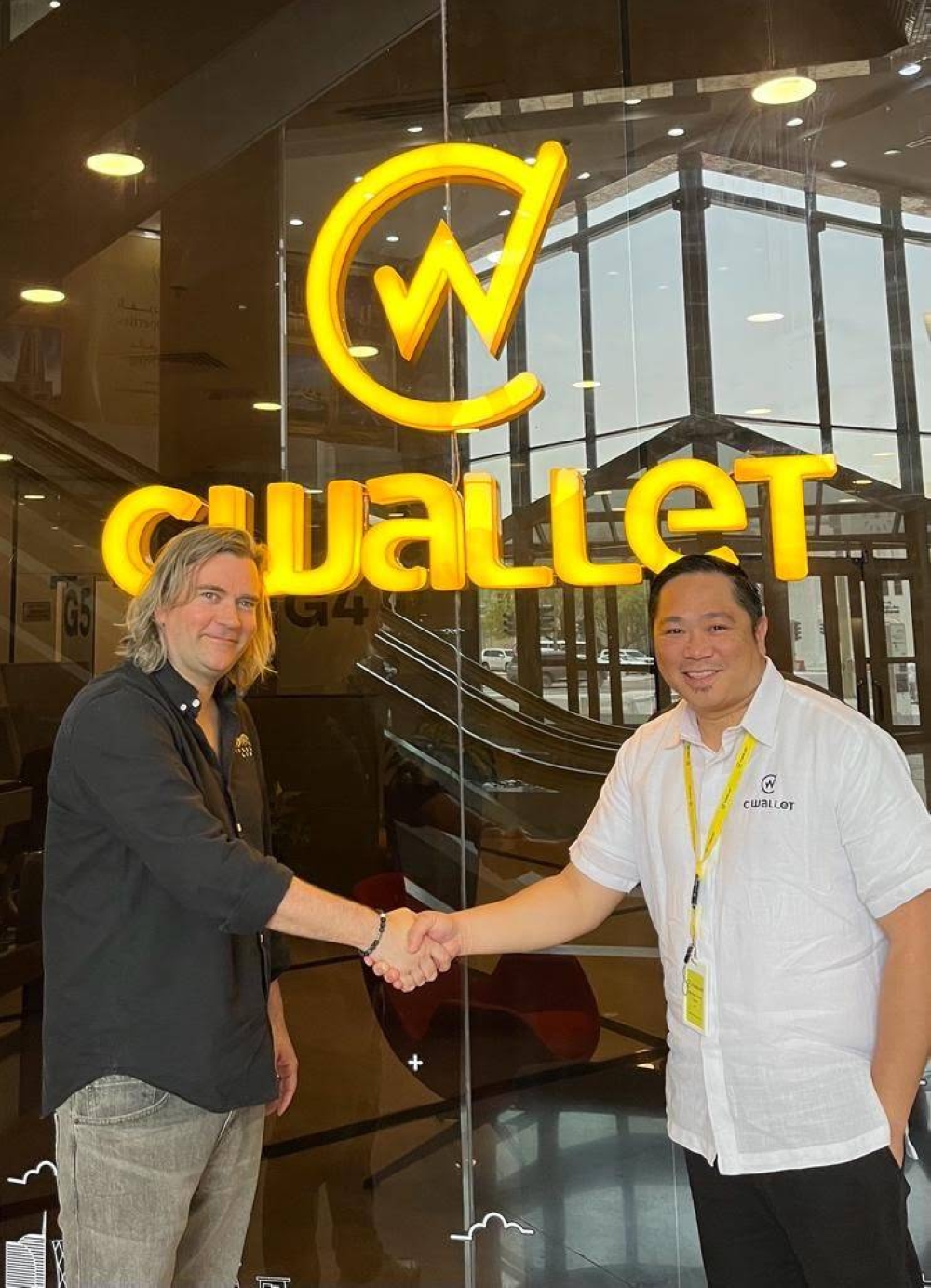 Michael Javier, CEO and founder of Doha-based fintech firm CWallet, shaking hands with Vesuvio Labs CEO and founder, Kristian Feldborg, who was one of the speakers of the 2023 edition of the Qatar Economic Forum, Powered by Bloomberg.