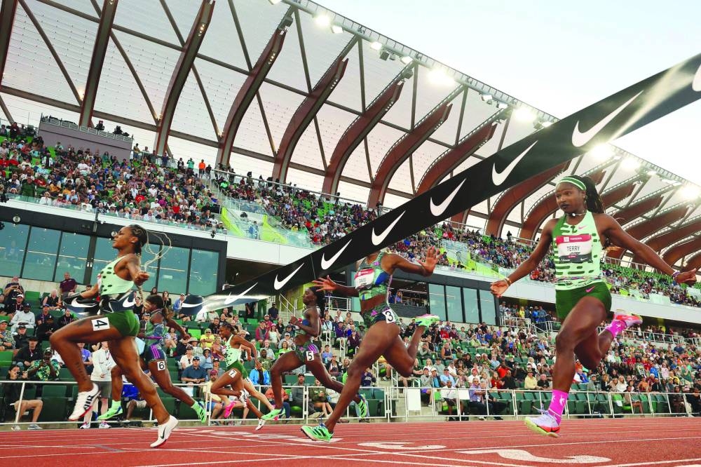 Sha’Carri Richardson breaks the tape to win the women’s 100m final on Saturday. (AFP)