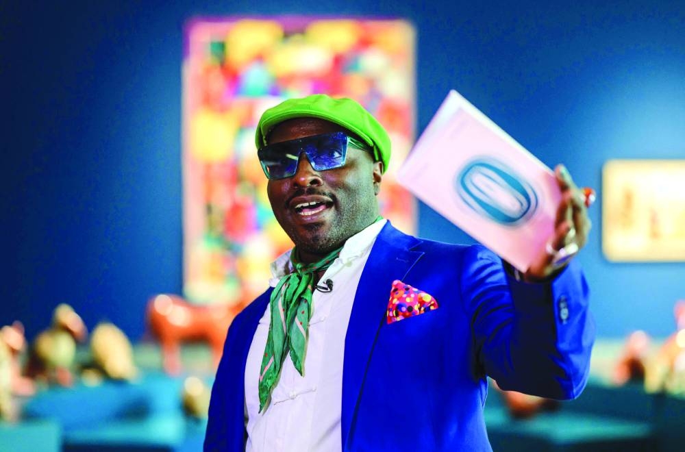 Cameroon-born artistic director Bonaventure Ndikung speaks to AFP reporters in an exhibition hall of the Haus der Kulturen der Welt museum in Berlin.(AFP)