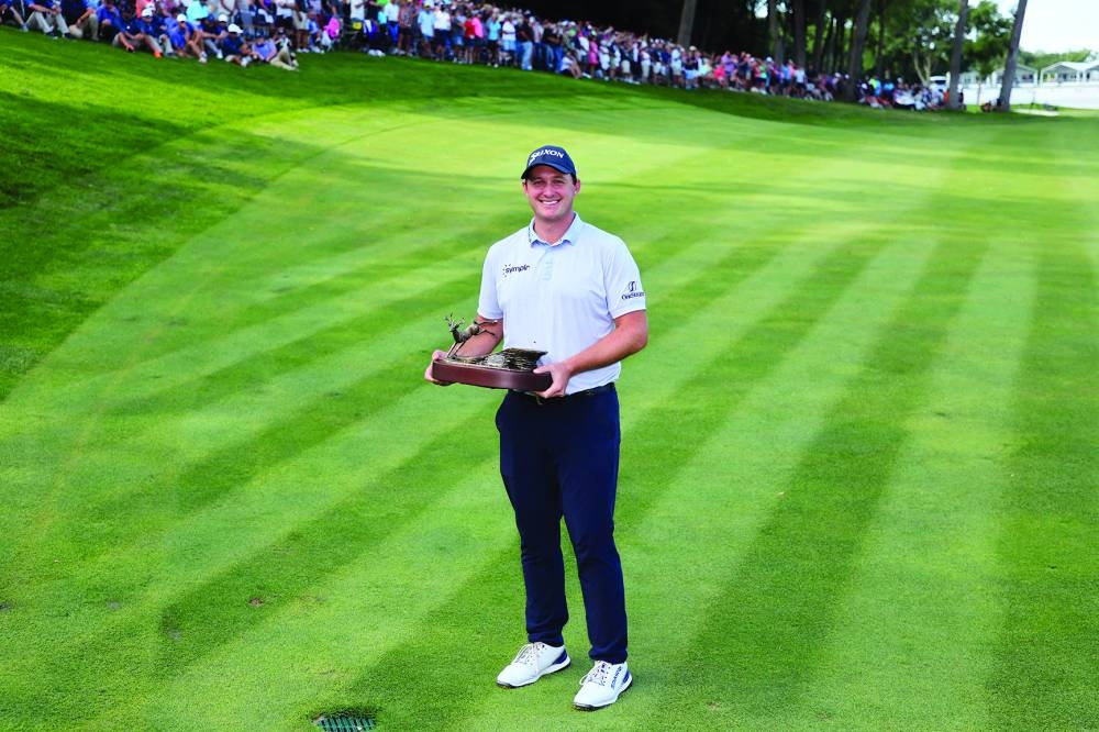 
Sepp Straka of Austria poses with the trophy after winning the John Deere Classic at TPC Deere Run in Silvis, Illinois. Right: Allisen Corpuz celebrates with the Harton S Semple Trophy after winning the US Women’s Open at Pebble Beach Golf Link. (AFP/USA TODAY Sports)  