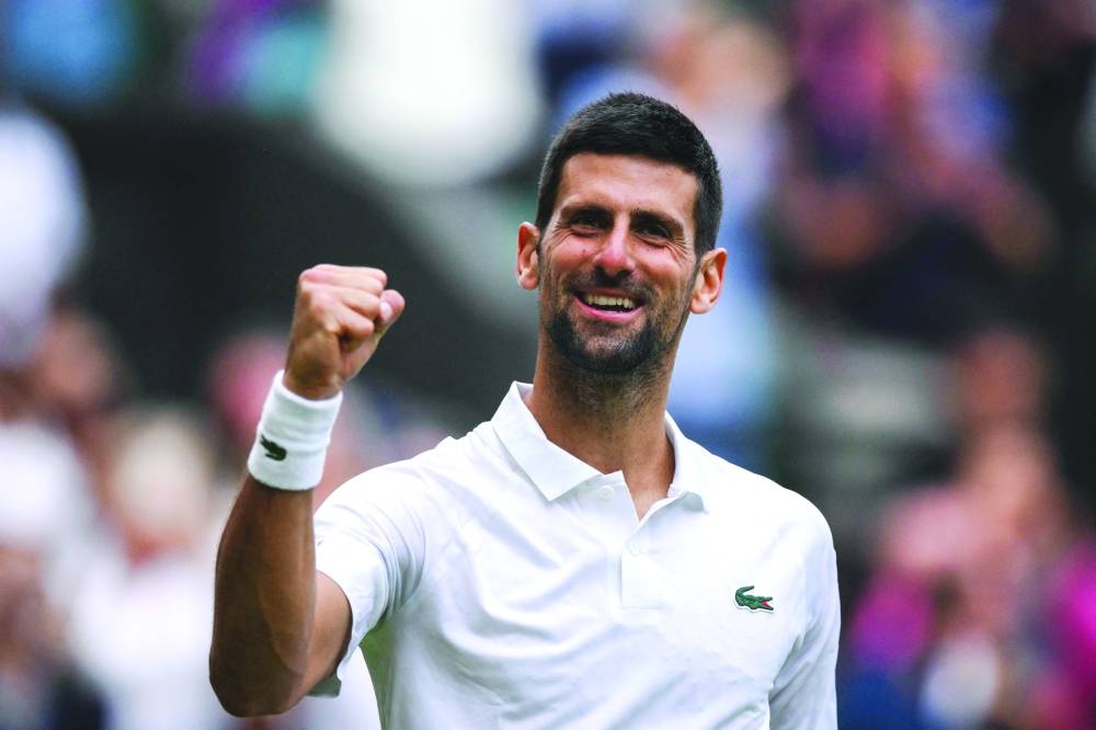 Serbia’s Novak Djokovic celebrates winning against Russia’s Andrey Rublev in their quarter-finals on Tuesday. (AFP)