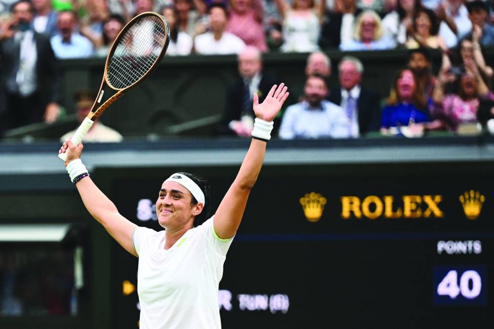Tunisia’s Ons Jabeur celebrates winning against Belarus’s Aryna Sabalenka during their Wimbledon semi-finals on Thursday. (AFP)