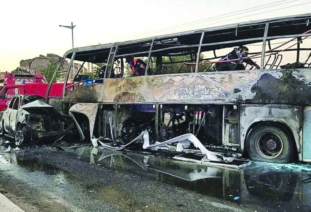 A view of a burnt bus and vehicle at the site of a road crash, in the city of Tamanrasset, Algeria in this handout picture obtained by Reuters, on Wednesday.