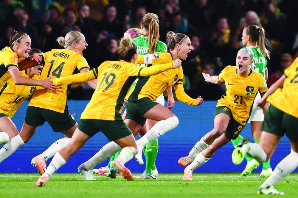 Australia’s defender Stephanie Catley (second right) celebrates with teammates after scoring a penalty during the Women’s World Cup Group B match against Ireland at Stadium Australia in Sydney on Thursday. (AFP)