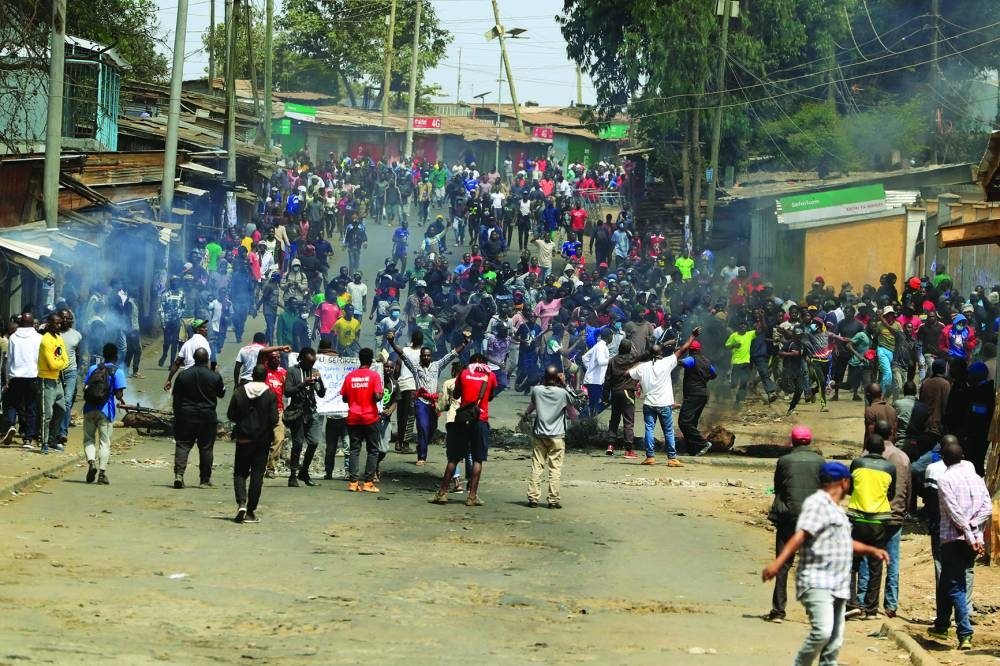 
Supporters of Kenya’s opposition leader Raila Odinga participate in an anti-government protest against the imposition of tax hikes by the government in Nairobi. 