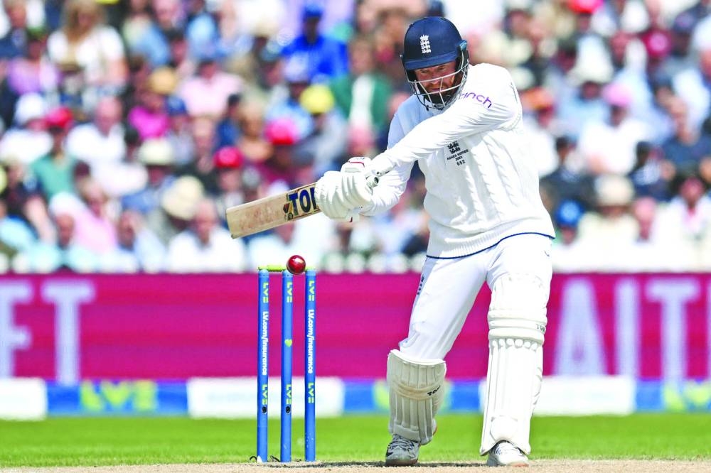 England’s Jonny Bairstow plays a shot on day three of the fourth Ashes Test against England at Old Trafford in Manchester, 
north-west England, on Friday. (AFP)
