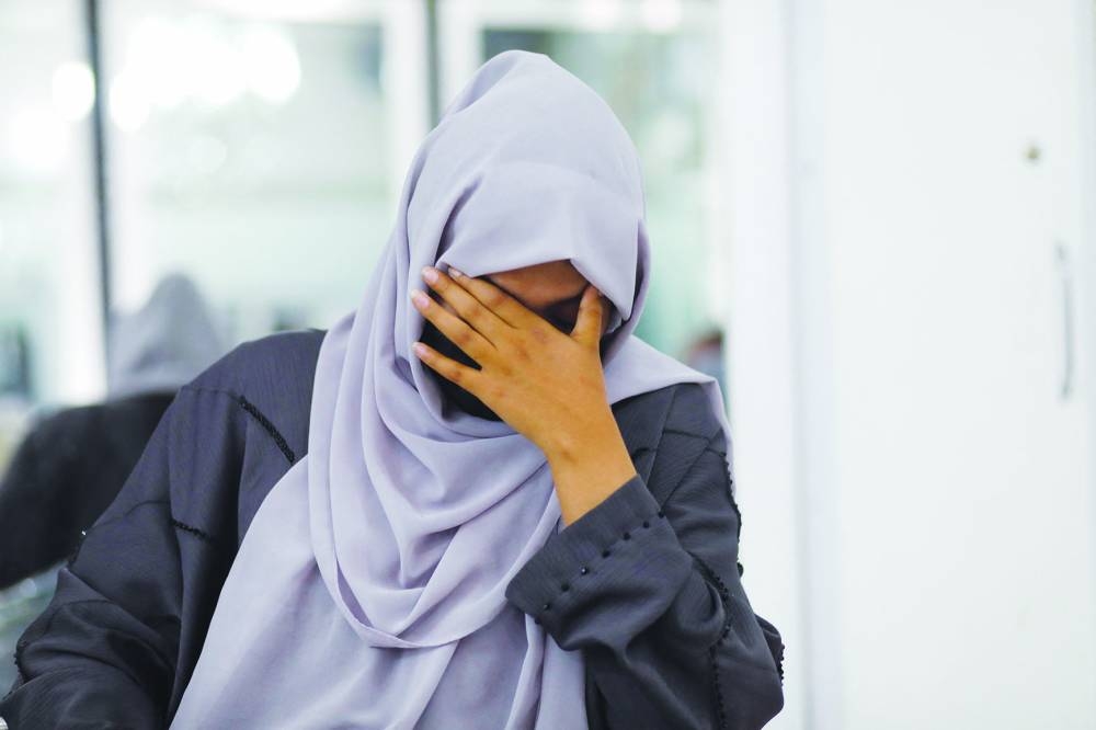 
A makeup artist cries during an interview with Reuters in a beauty salon in Kabul. 