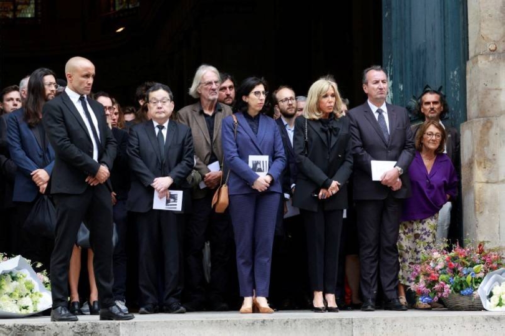 French Culture Minister Rima Abdul Malak, Brigitte Macron, the wife of French President Emmanuel Macron, relatives and friends leave after the funeral ceremony for late singer, actress and muse Jane Birkin, at the Church of Saint-Roch in Paris, France, July 24, 2023. REUTERS/Pascal Rossignol