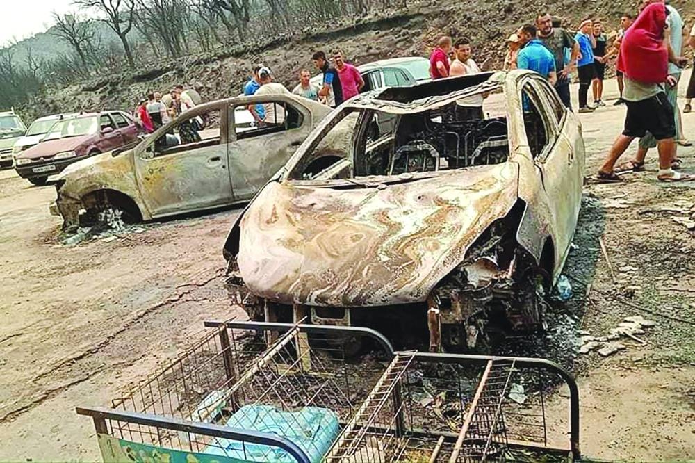 This handout picture released on the Facebook page of Radio Soummam Bejaia on Tuesday shows the aftermath of Algeria’s wildfires in Toudja town as temperatures hit 48C.
