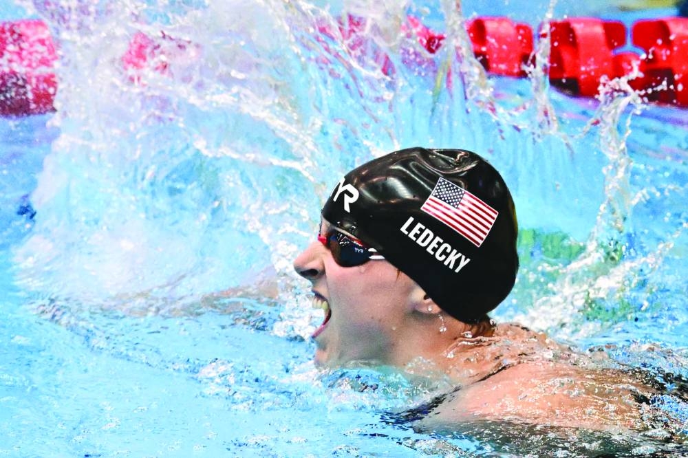 USA’s Katie Ledecky celebrates after winning gold in the women’s 1500m freestyle during the World Aquatics Championships in 
Fukuoka, Japan, on Tuesday. (Reuters)