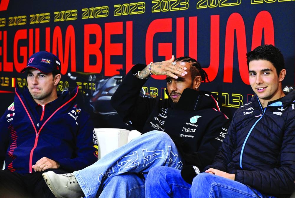 FROM LEFT: Red Bull Racing’s Mexican driver Sergio Perez, Mercedes’ British driver Lewis Hamilton and Alpine’s French F1 driver Esteban Occon attend a press conference ahead of the Belgian Grand Prix at the Spa-Francorchamps circuit in Spa, on Thursday. (AFP)
