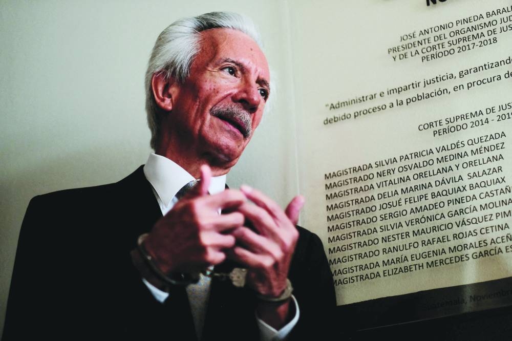 
FILE PHOTO: Journalist Jose Ruben Zamora Marroquin, founder and president of elPeriodico<!--closing bold italic--> newspaper, talks with the media as he attends a court hearing in Guatemala City, Guatemala, on December 8, 2022. 