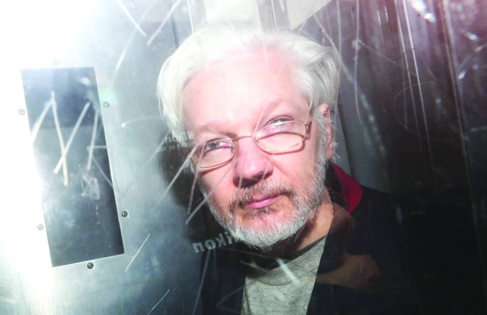 
This file picture shows Assange leaving Westminster Magistrates Court in London. 