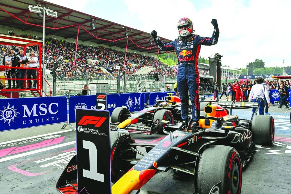 Red Bull Racing’s Dutch driver Max Verstappen (also inset) celebrates in the parc ferme after winning the Formula One Belgian Grand Prix at the Spa-Francorchamps Circuit in Spa on Sunday. (AFP)