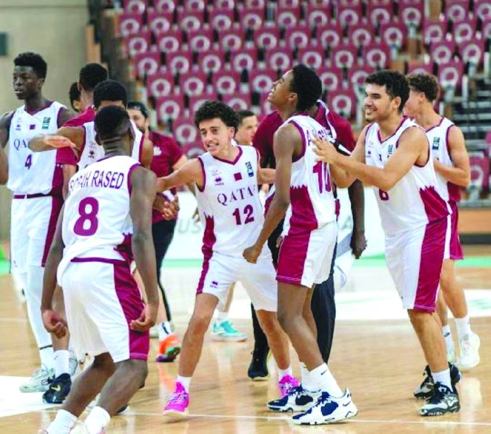 Qatar players celebrate during their match against Saudi Arabia on Sunday.