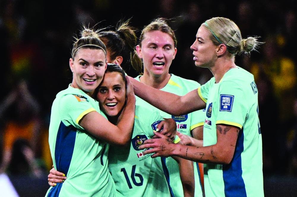 Australia’s forward Hayley Raso (second left) celebrates scoring during the FIFA Women’s World Cup Group ‘B’ match against Canada at Melbourne Rectangular Stadium in Melbourne on Monday. (AFP)
