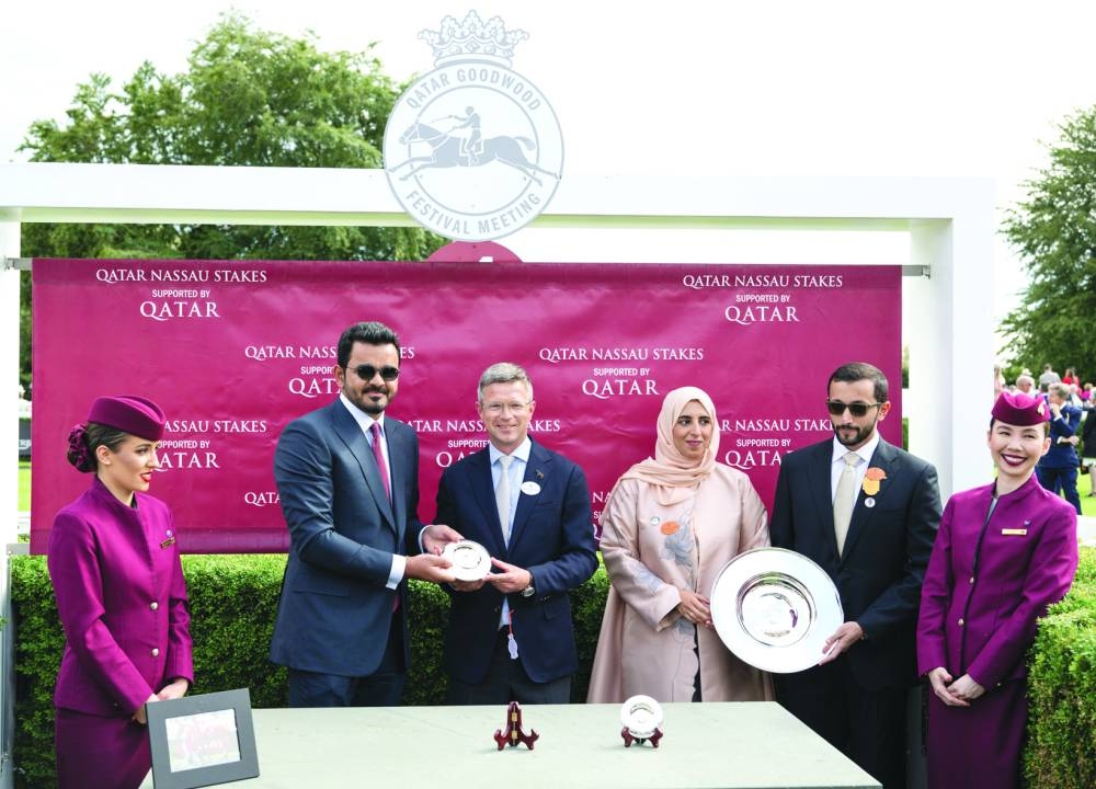 HE Sheikh Joaan bin Hamad al-Thani, President of Qatar Olympic Committee, presents the trophy to Roger Varian, the trainer of Shadwell’s Al Husn, which won the Group 1 Qatar Nassau Stakes on the third day of the Qatar Goodwood Festival at the Goodwood Racecourse in UK yesterday. PICTURES: Dominic James