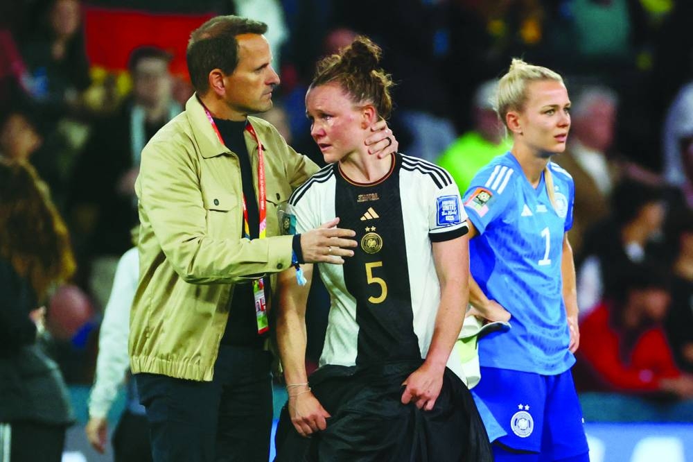 Germany’s defender Marina Hegering is in tears after a draw with South Korea knocked them out of the Women’s World Cup at Brisbane Stadium in Brisbane on Thursday. (AFP)