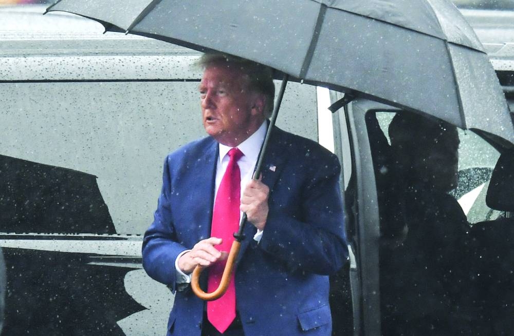 
Trump arriving at the Ronald Reagan Washington National Airport in Arlington, Virginia, after his arraignment in court. 