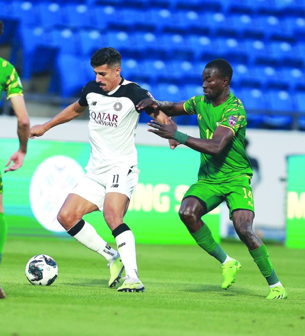 Al Sadd’s Baghdad Bounedjah (left) vies for the ball with Al Shorta’s Abdoul Madjid Moumouni during quarter-finals of the King Salman Club Cup at the Prince Sultan bin Abdulaziz Sports City Stadium in Abha, Saudi Arabia, on Saturday.
