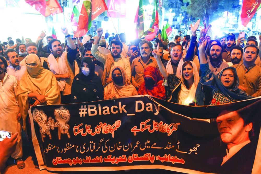 
Supporters of former prime minister Imran Khan, shout anti-government slogans during a protest in Quetta yesterday. (Reuters, AFP) 