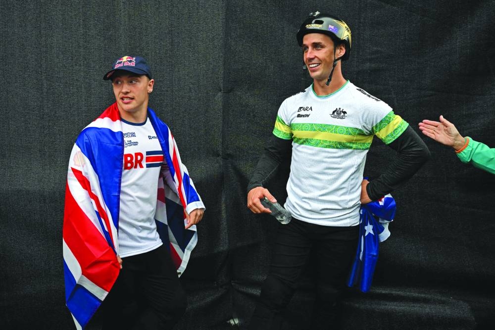Gold medal winner Great Britain’s Kieran Reilly and silver medallist Australia’s Logan Martin celebrate after the men’s BMX Freestyle Park Final during the UCI Cycling World Championships in Glasgow, Scotland, on Monday. (AFP)