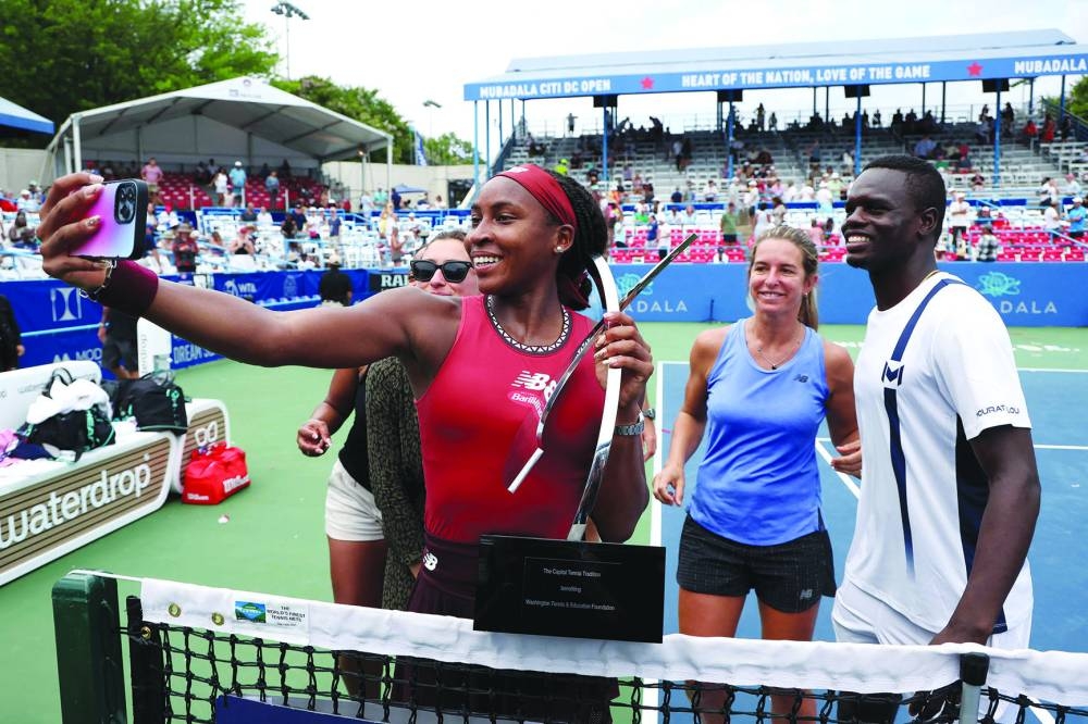 
Coco Gauff of the US takes a selfie with members of her team after defeating Maria Sakkari of Greece in the women’s singles final of Washington Open. (AFP) 